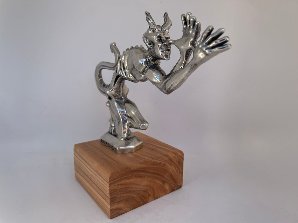 Handcrafted pewter Speed Demon ornament with sleek curves and detailed sculptural finish