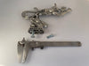 Custom Speed Demon hood ornament hand-sculpted and cast in solid pewter metal showing the mounting and scale
