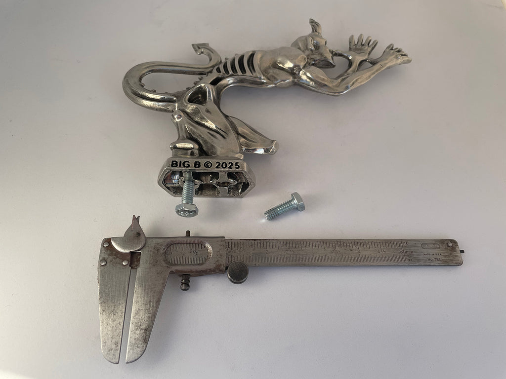Custom Speed Demon hood ornament hand-sculpted and cast in solid pewter metal showing the mounting and scale