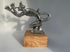 Polished metal Speed Demon automotive hood ornament inspired by classic hot rod styling